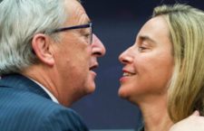 European Commission President Jean-Claude Juncker, left, greets EU High Representative for Foreign Affairs and Security Policy and Vice-President of the Commission Federica Mogherini at the start of the first meeting of the Juncker Commission at the European Commission headquarters in Brussels, Wednesday, Nov. 5, 2014. (AP Photo/Geert Vanden Wijngaert)
